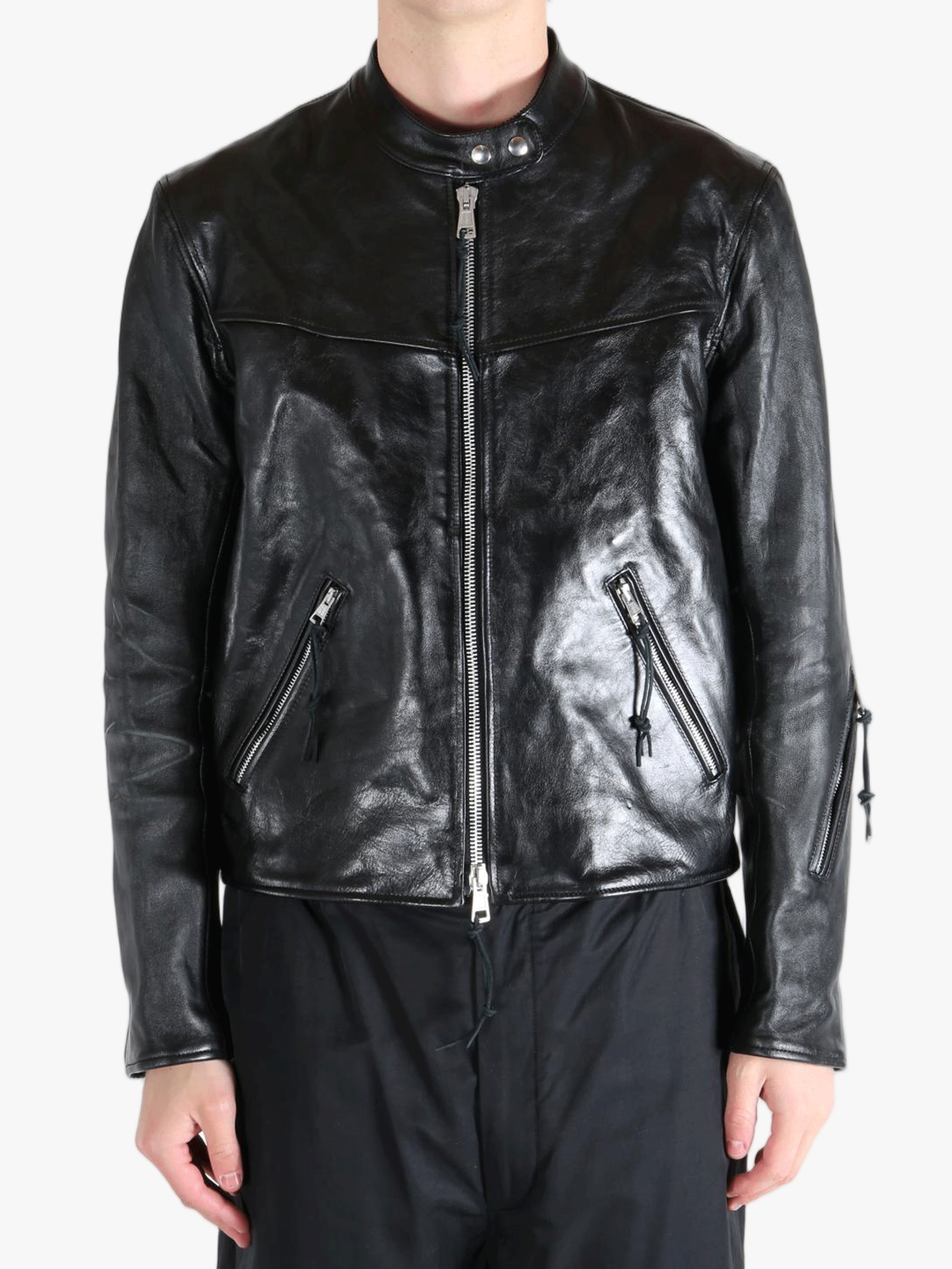 Black leather jacket worn by a person, showing the jacket fit