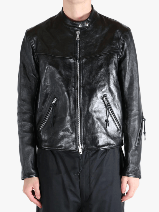 Black leather jacket worn by a person, showing the jacket fit