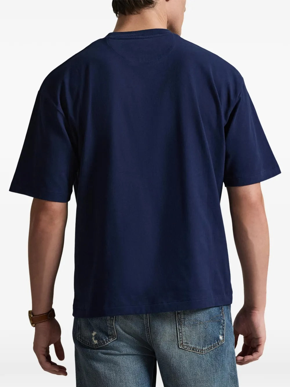 Navy T-shirt worn by a person, showing the shirt's fit