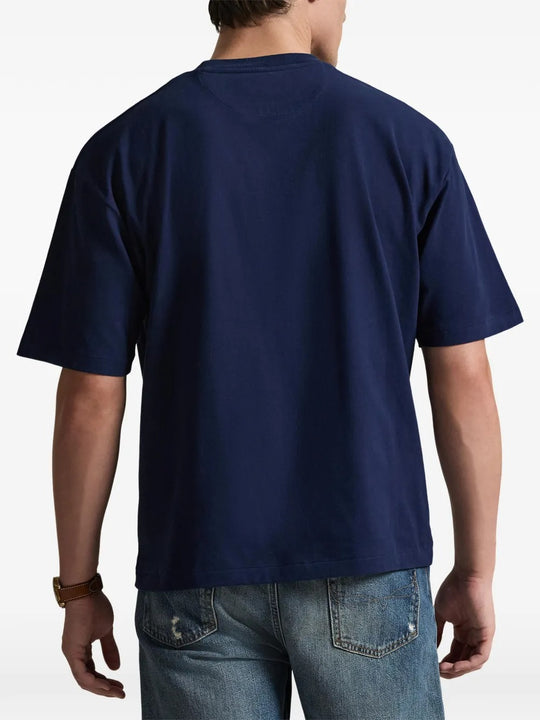 Navy T-shirt worn by a person, showing the shirt's fit