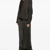 Brown jackets worn by a person, showing the jackets's fit