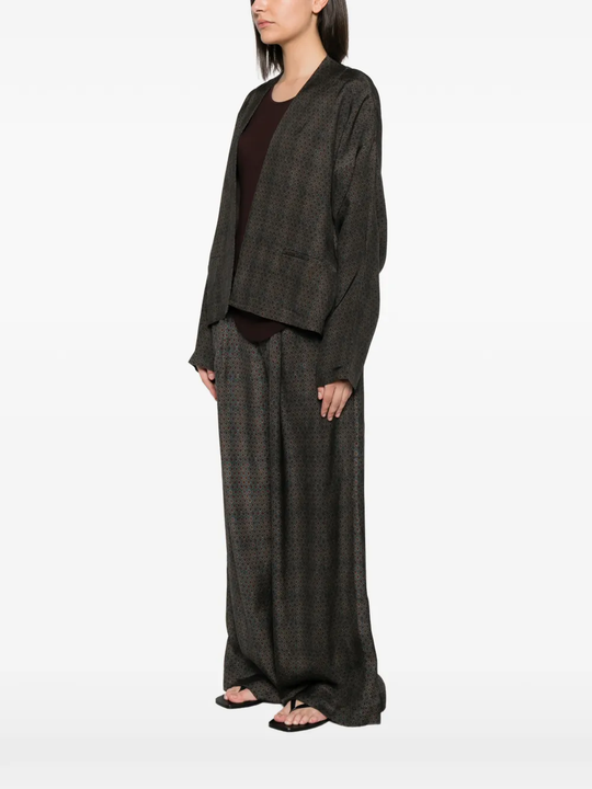 Brown jackets worn by a person, showing the jackets's fit