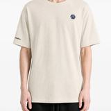 Tan t-shirt worn by a person, showing the t-shirt fit