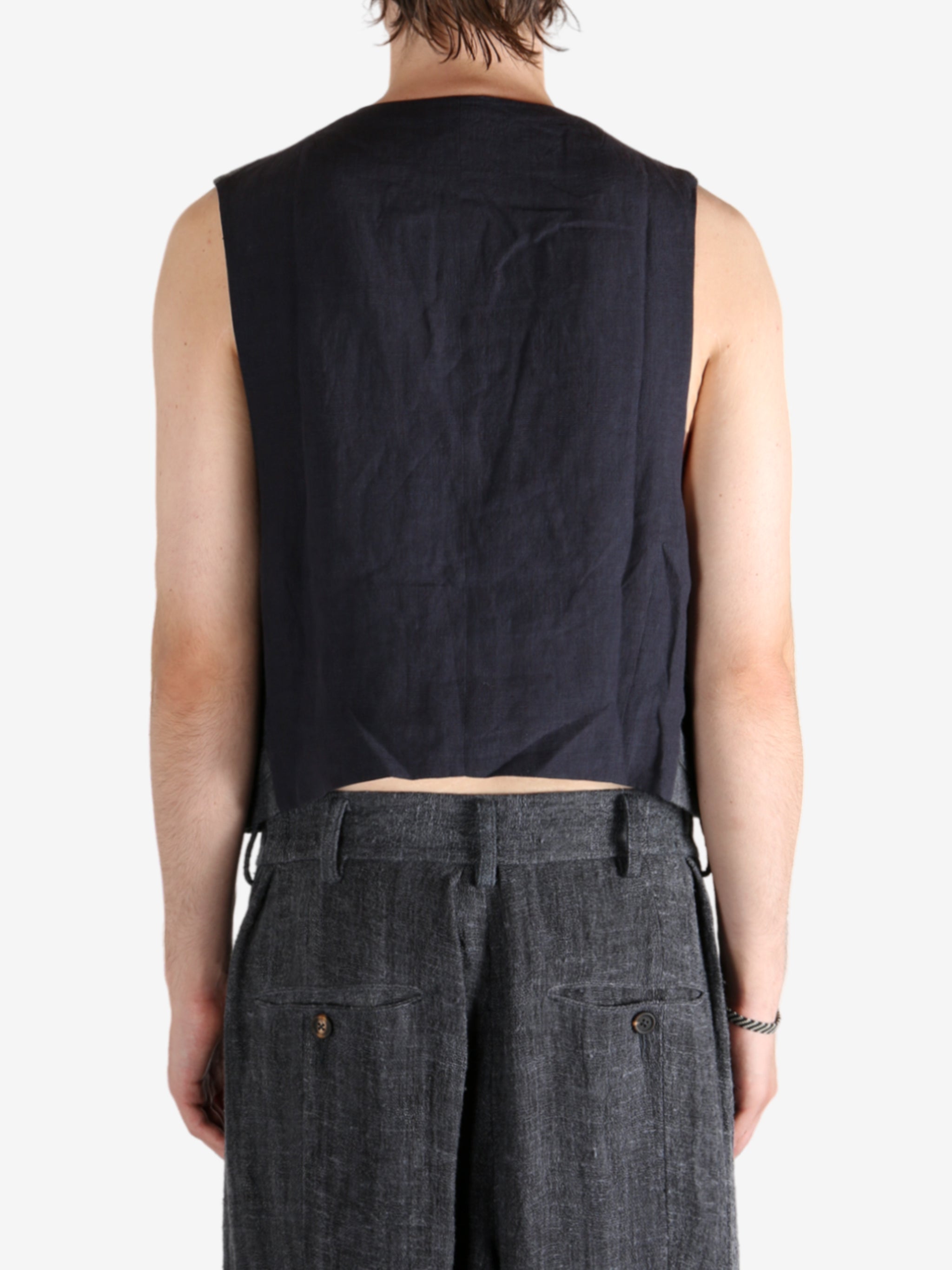 Grey waistcoat worn by a person, showing the waistcoat fit