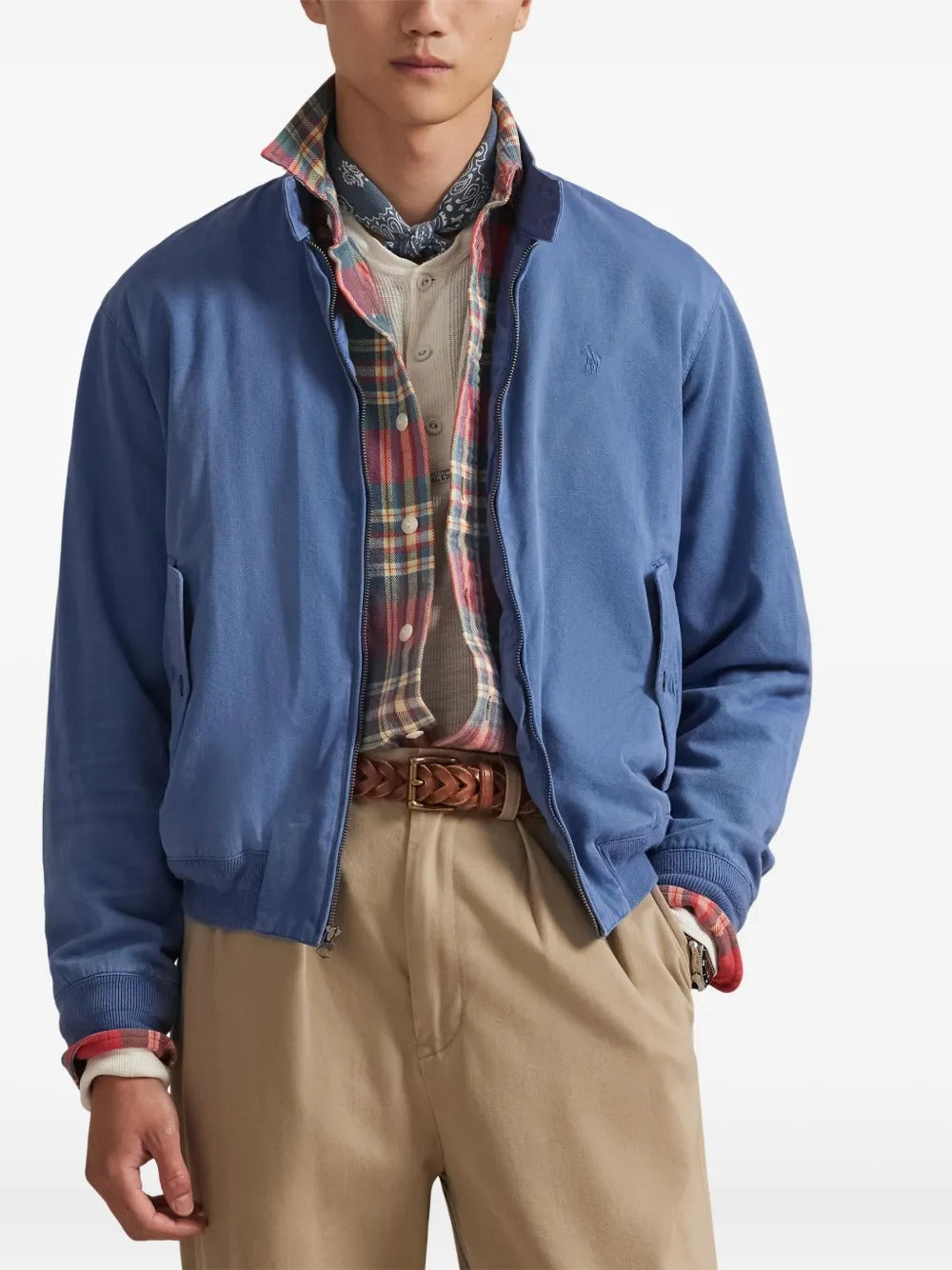 Blue jacket worn by a person, showing the jacket's fit