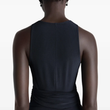 Black top worn by a person, showing the tops fit