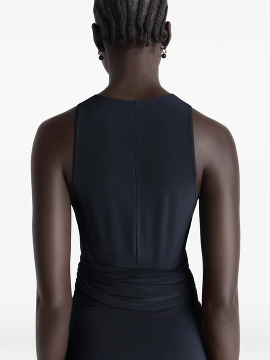 Black top worn by a person, showing the tops fit
