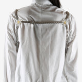 White top worn by a person, showing the top's fit