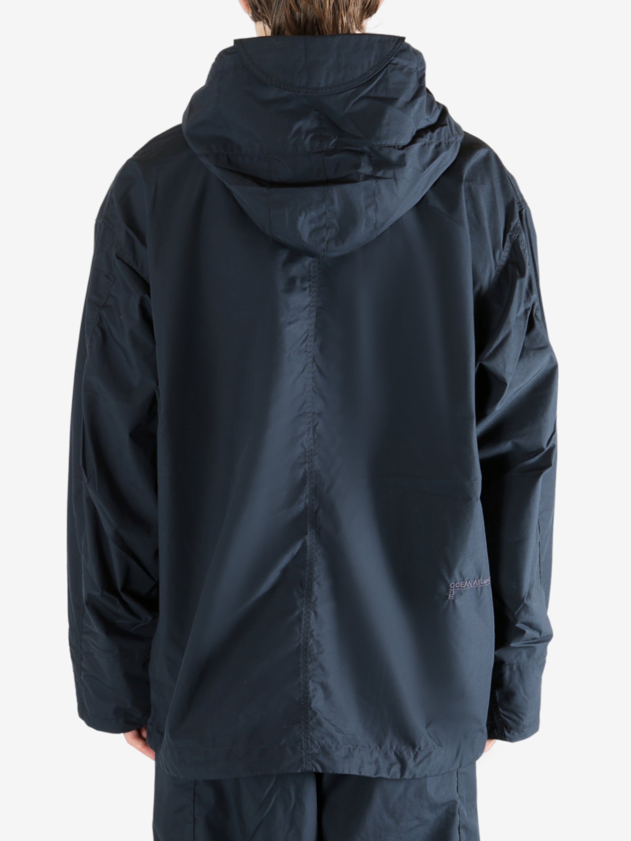 Navy jacket worn by a person, showing the jacket's fit