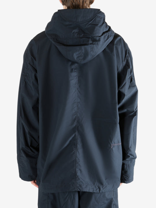 Navy jacket worn by a person, showing the jacket's fit