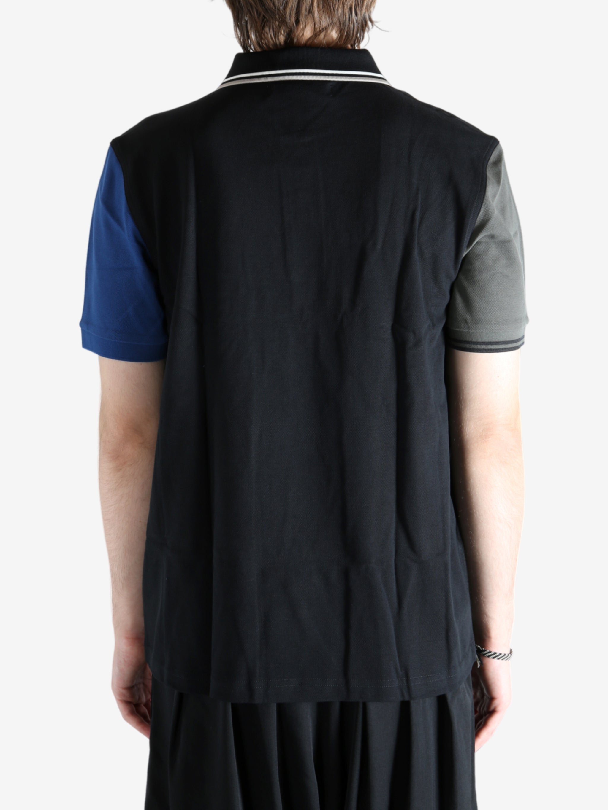 Black T-shirt worn by a person, showing the T-shirt's fit