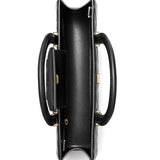 Close up of black bag, showing texture of the leather fabric