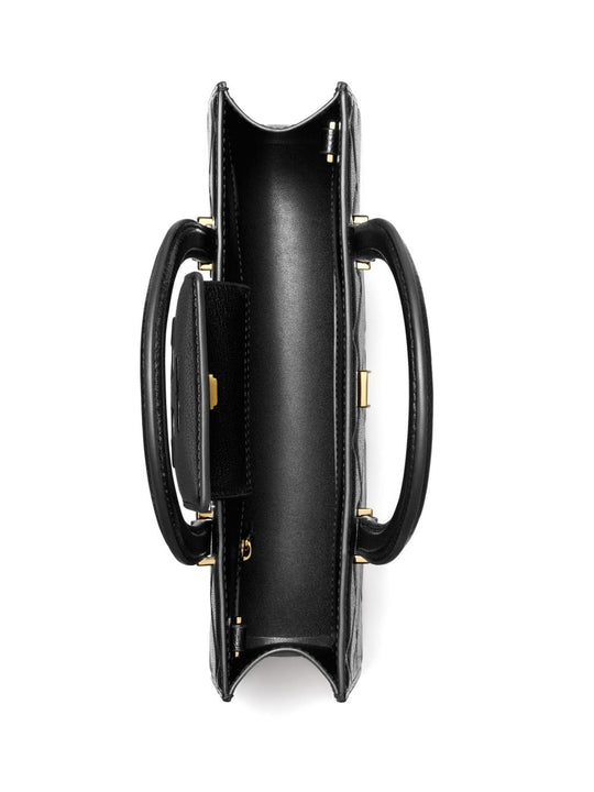 Close up of black bag, showing texture of the leather fabric