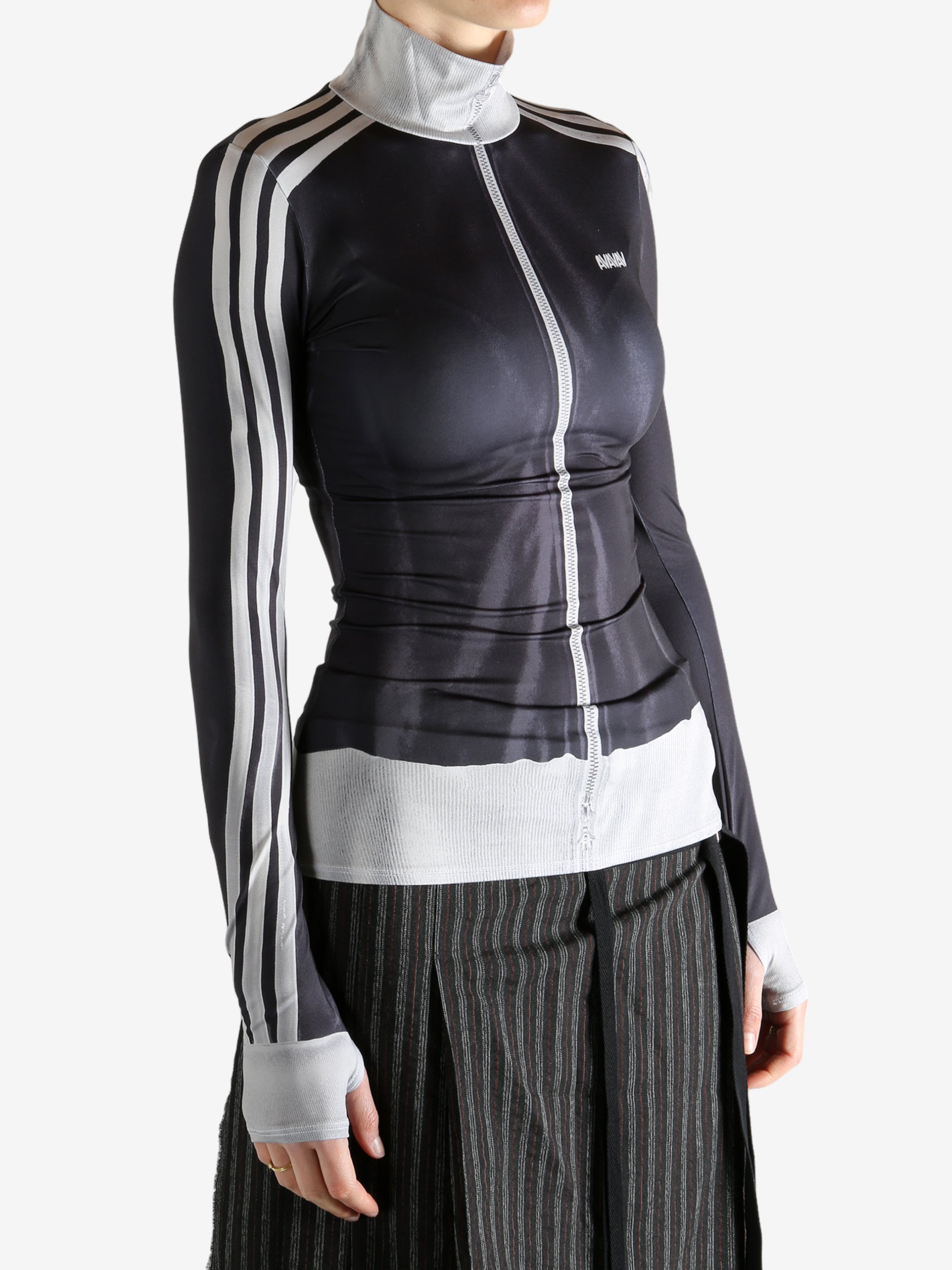 black jacket worn by a person, showing the jacket fit