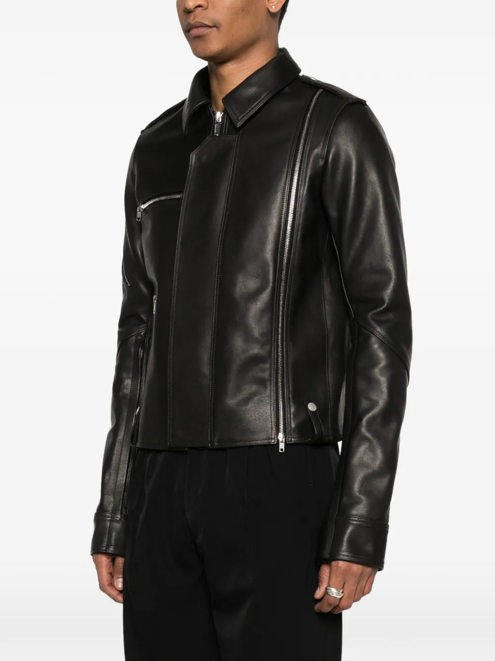 Black jacket worn by a person, showing the jacket fit