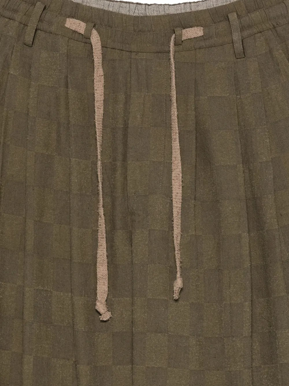Close up of brown pants, showing texture of the linen fabric