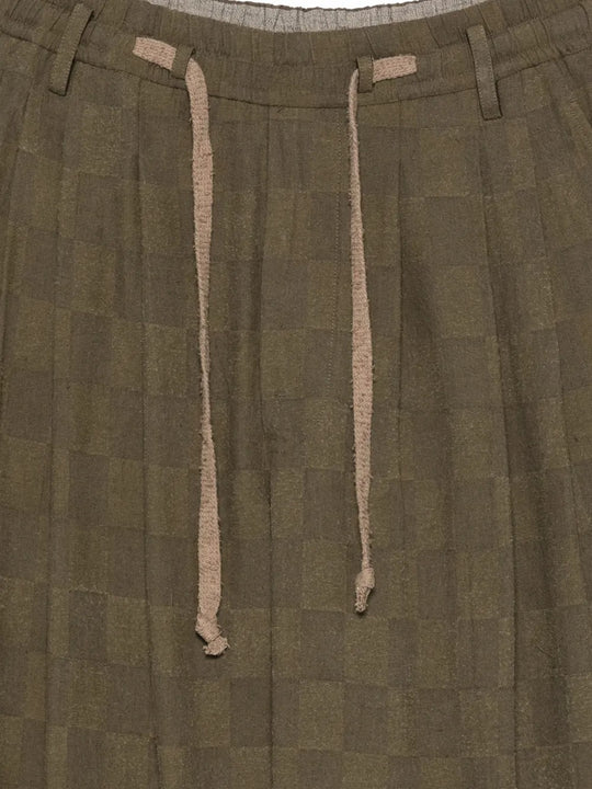 Close up of brown pants, showing texture of the linen fabric
