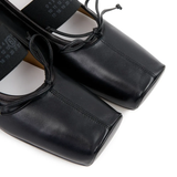 Close up of black shoes,showing texture of the leather fabric.