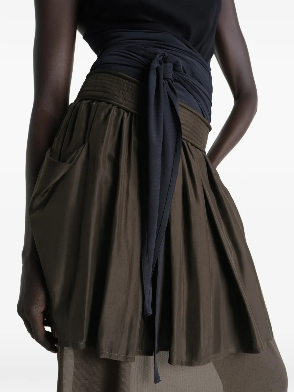 Close up of brown skirt, showing texture of the Silk fabric