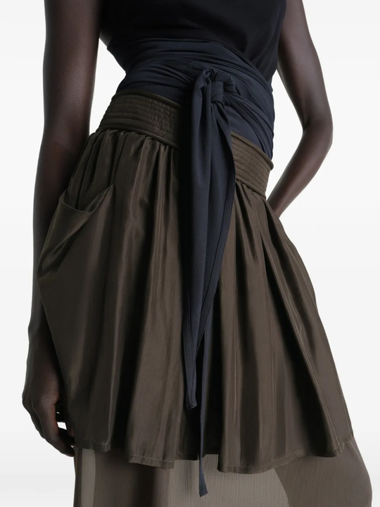 Close up of brown skirt, showing texture of the Silk fabric