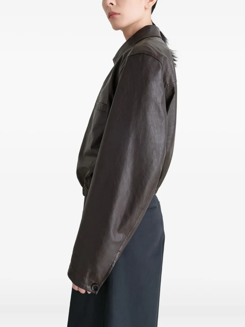 Brown tops worn by a person, showing the tops fit