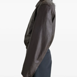 Brown tops worn by a person, showing the tops fit