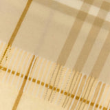 Close up of the tan scarf, showing texture of the cashmere fabric