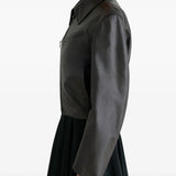 Brown jacket worn by a person, showing the jacket's fit