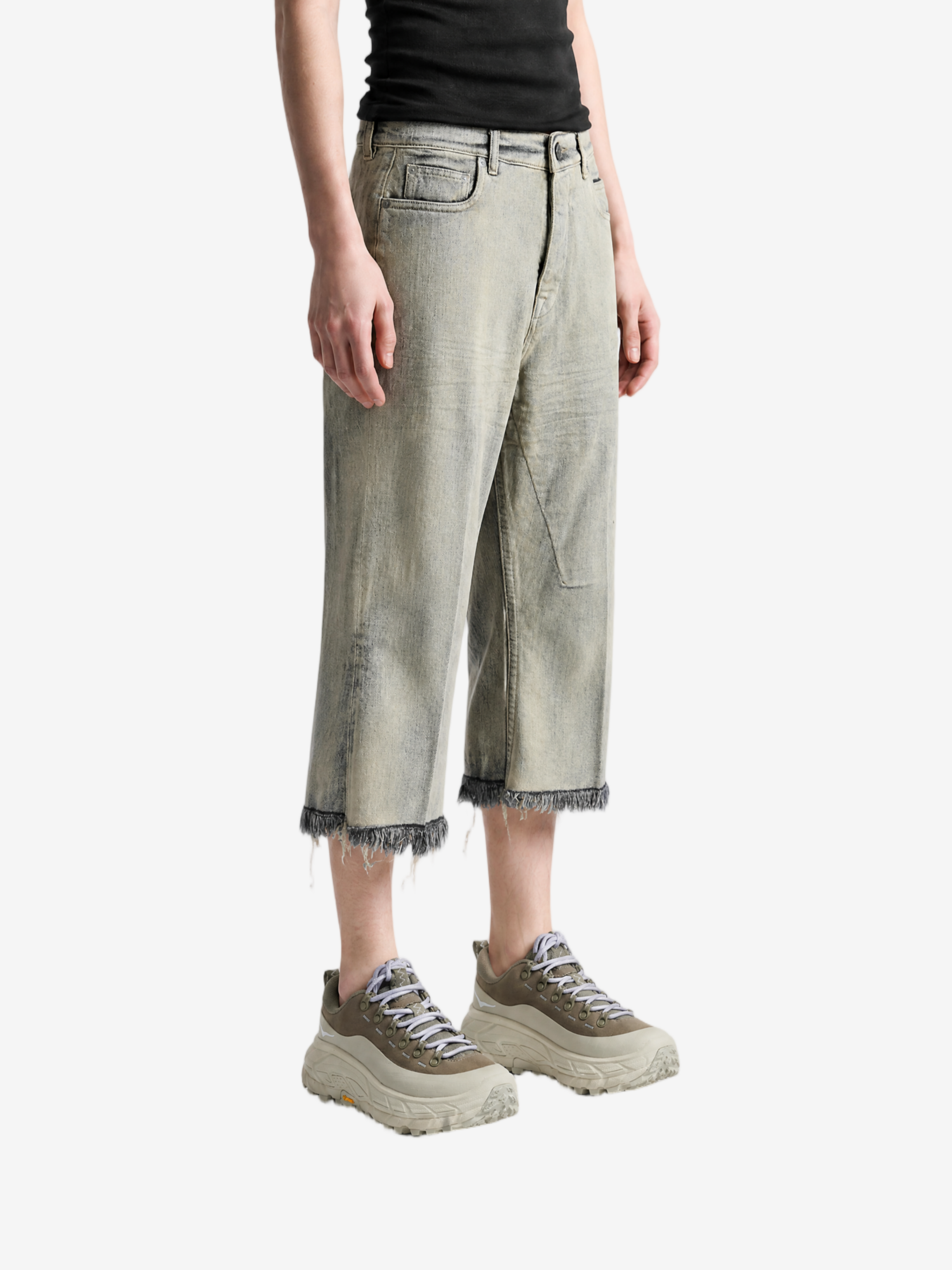 Grey pants worn by a person, showing the pants fit