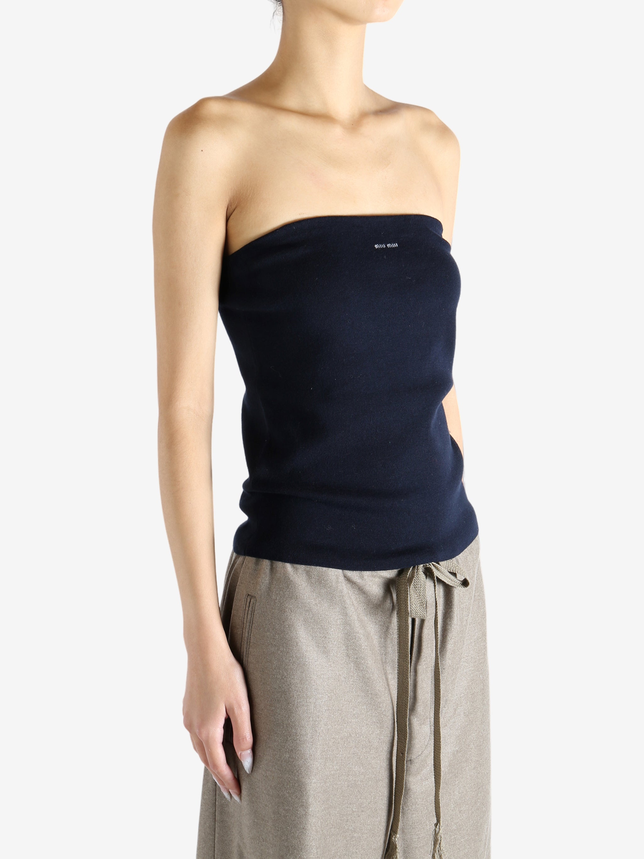 Navy top worn by a person, showing the top's fit