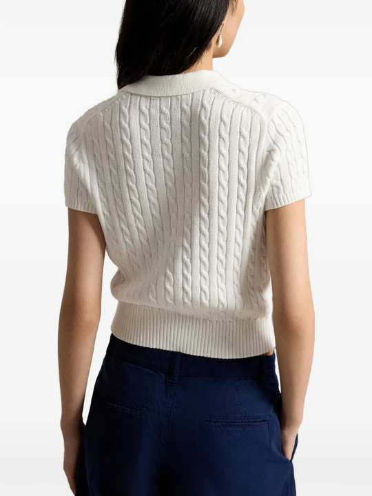 White t-shirt worn by a person, showing the shirt's fit