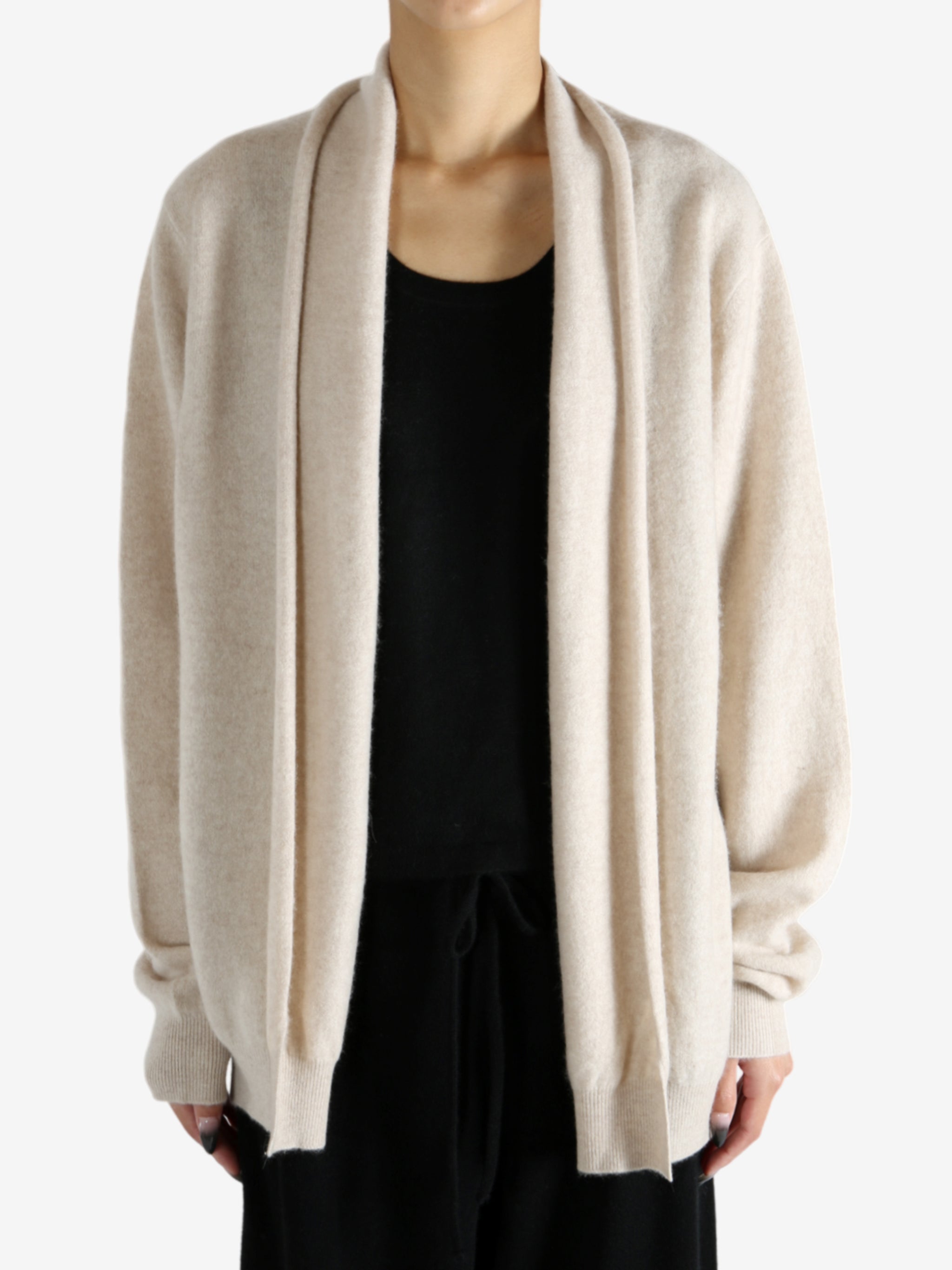 Tan cardigan worn by a person, showing the cardigan's fit