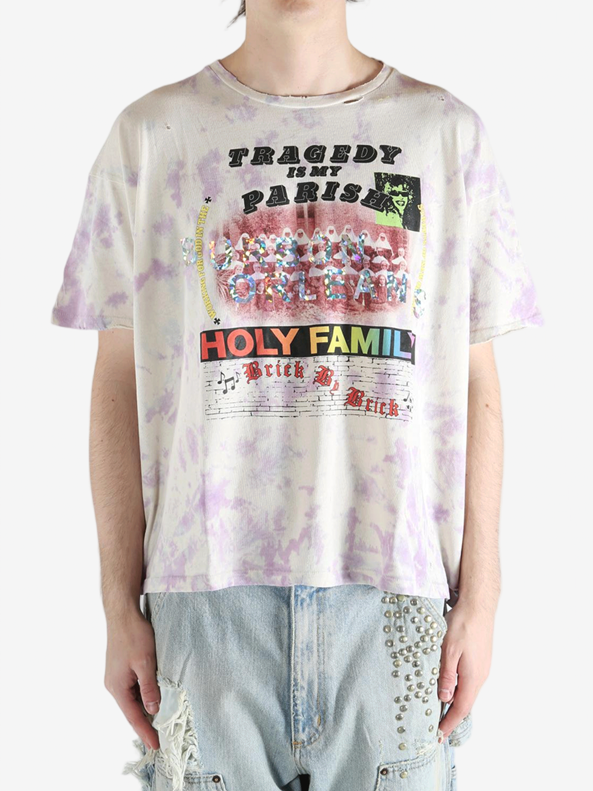 White t-shirt worn by a person, showing the shirt's fit