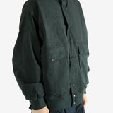 Grey jacket worn by a person, showing the jacket's fit