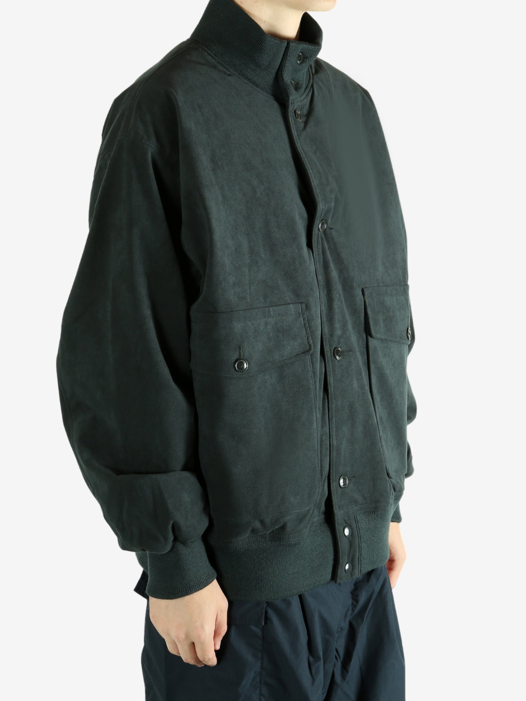 Grey jacket worn by a person, showing the jacket's fit