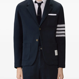 navy jacket worn by a person, showing the jacket fit