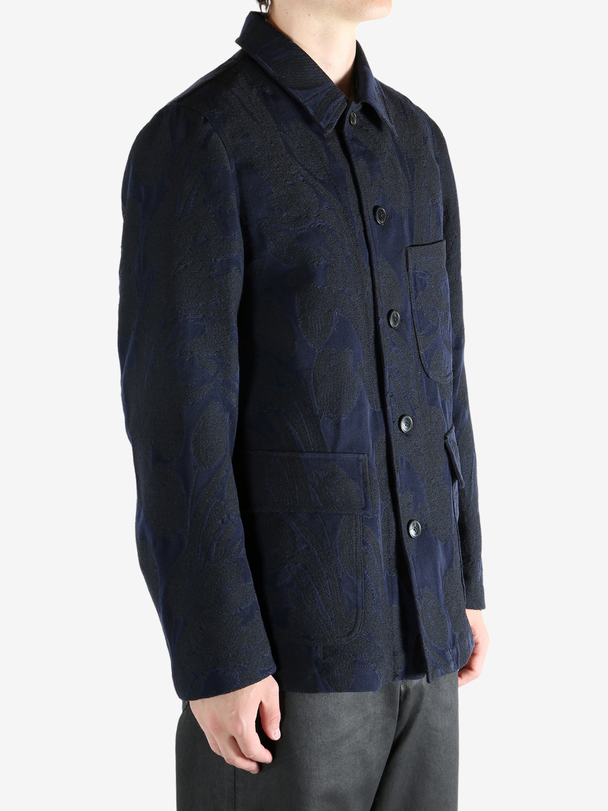 Navy jacket worn by a person, showing the jacket's fit