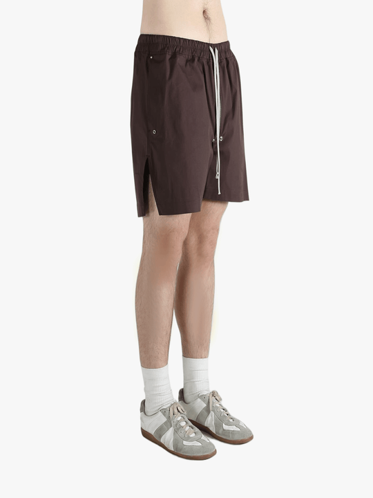 Brown shorts worn by a person, showing the shorts's fit