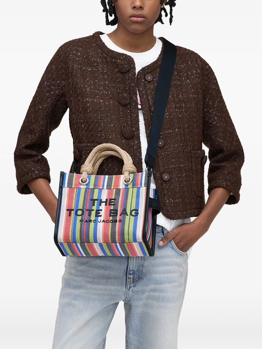 Red bag worn by a person, showing the bag's fit