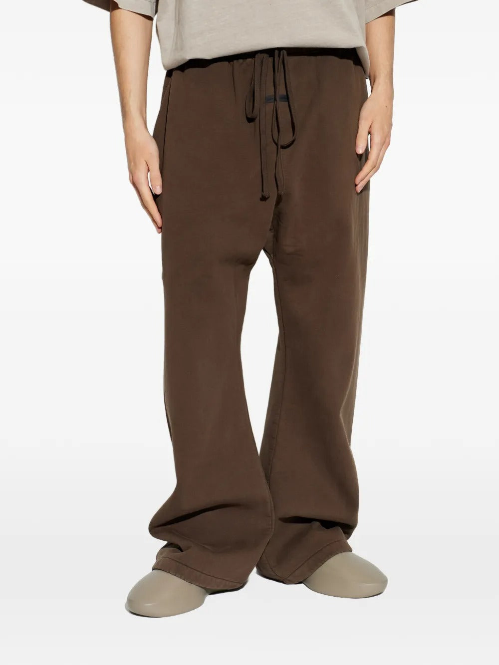 Brown pants worn by a person, showing the pants fit