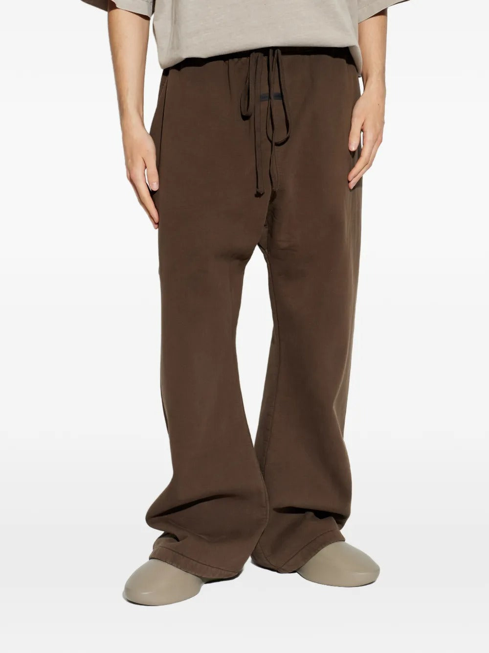 Brown pants worn by a person, showing the pants fit