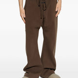 Brown pants worn by a person, showing the pants fit