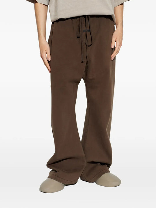 Brown pants worn by a person, showing the pants fit