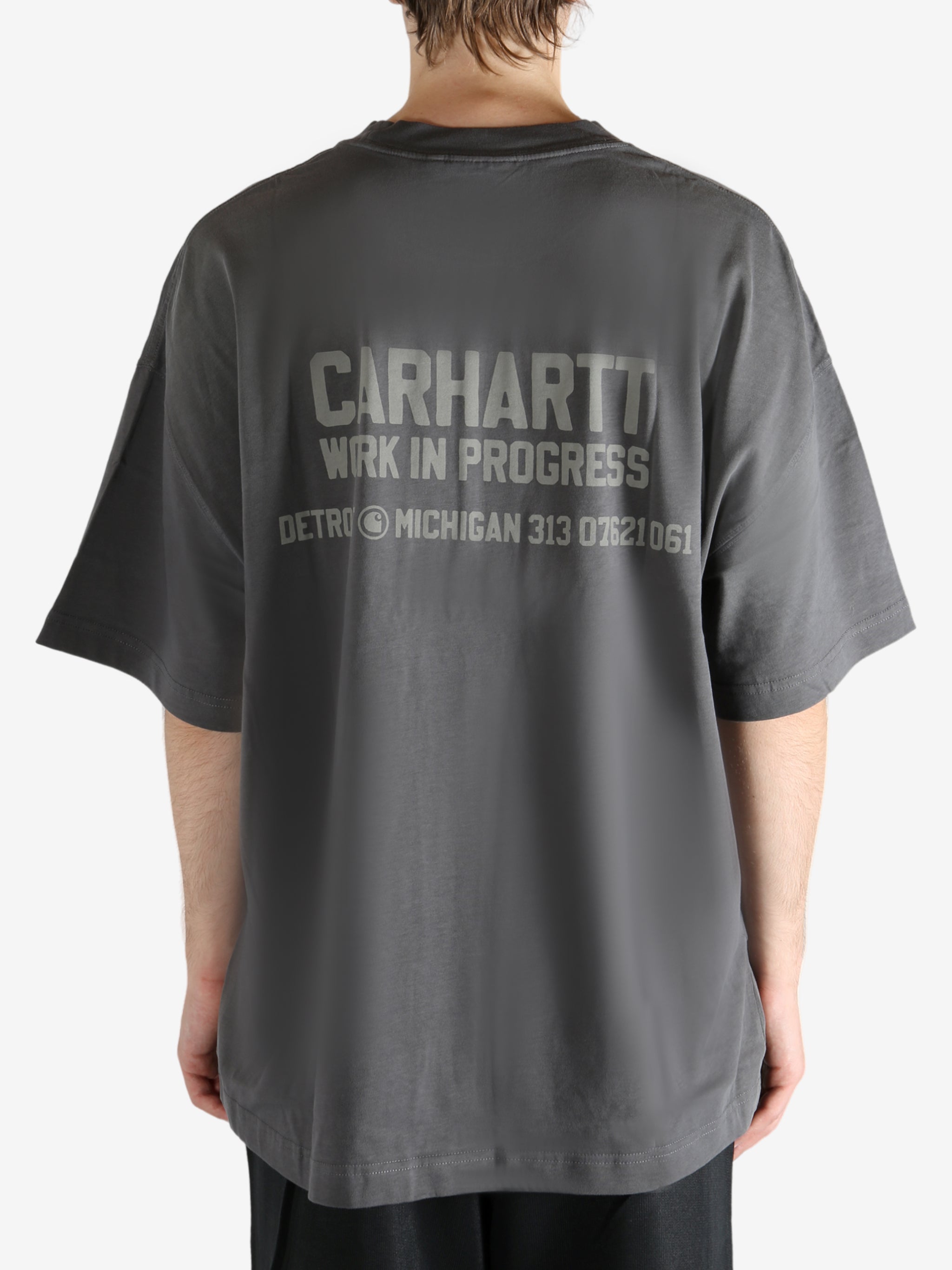 Grey t-shirt worn by a person, showing the t-shirt's fit