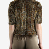 Grey knitwear worn by a person, showing the knitwear's fit