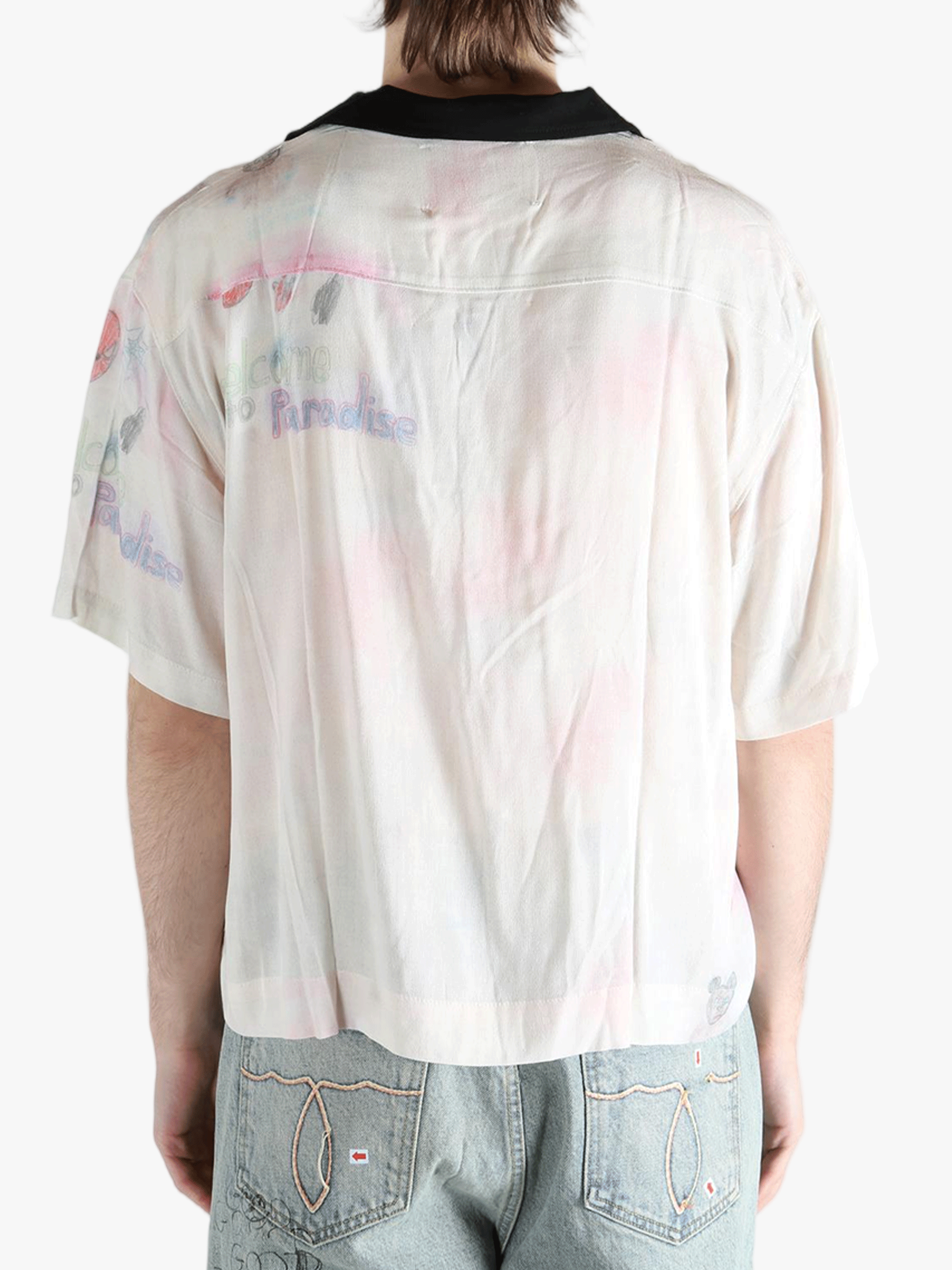 White shirt worn by a person, showing the shirt's fit