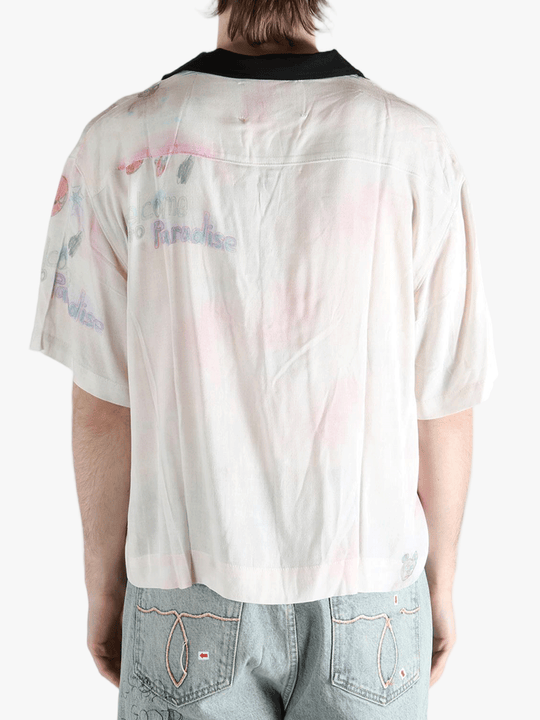 White shirt worn by a person, showing the shirt's fit