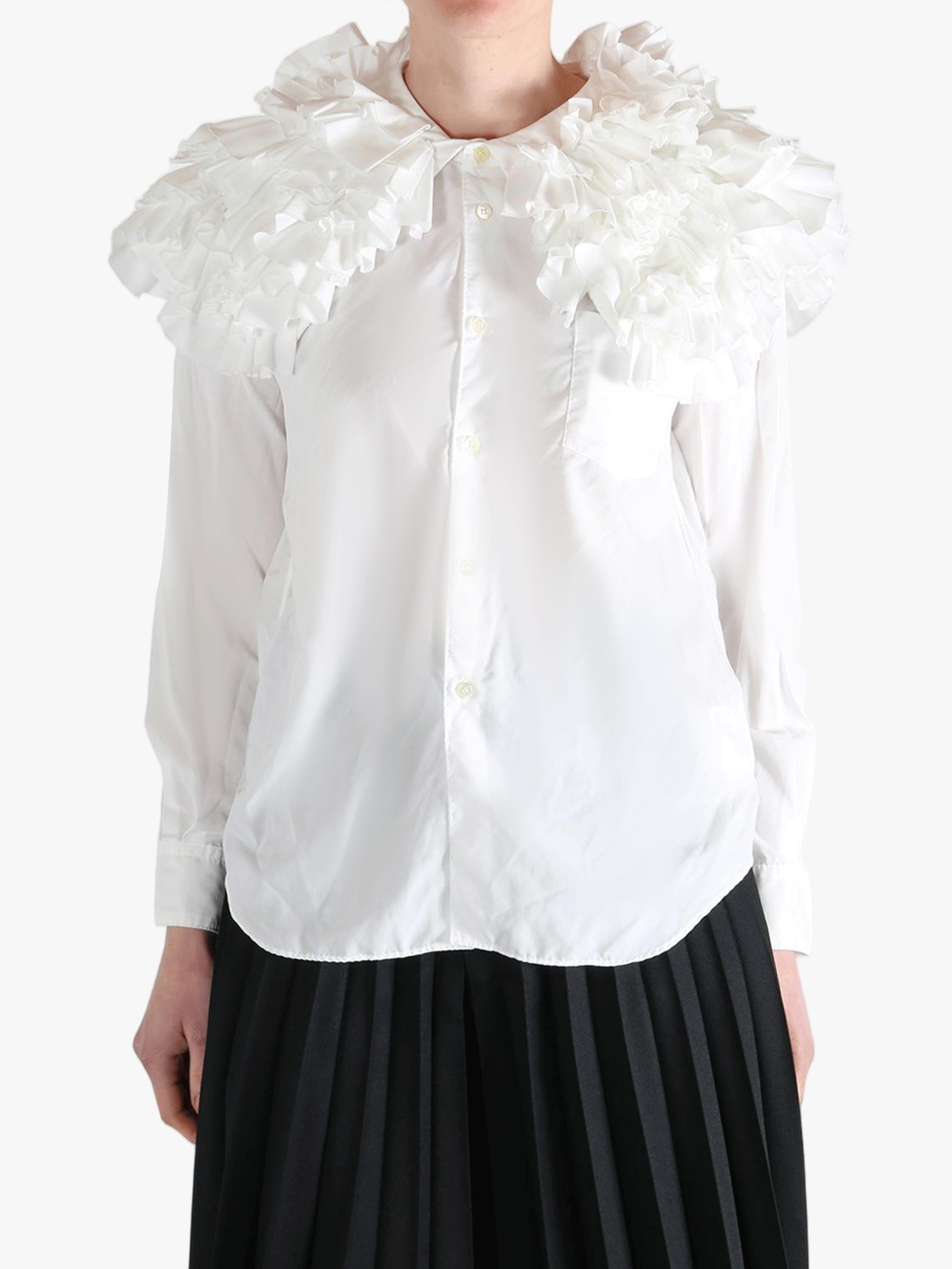 White shirt worn by a person, showing the shirt's fit