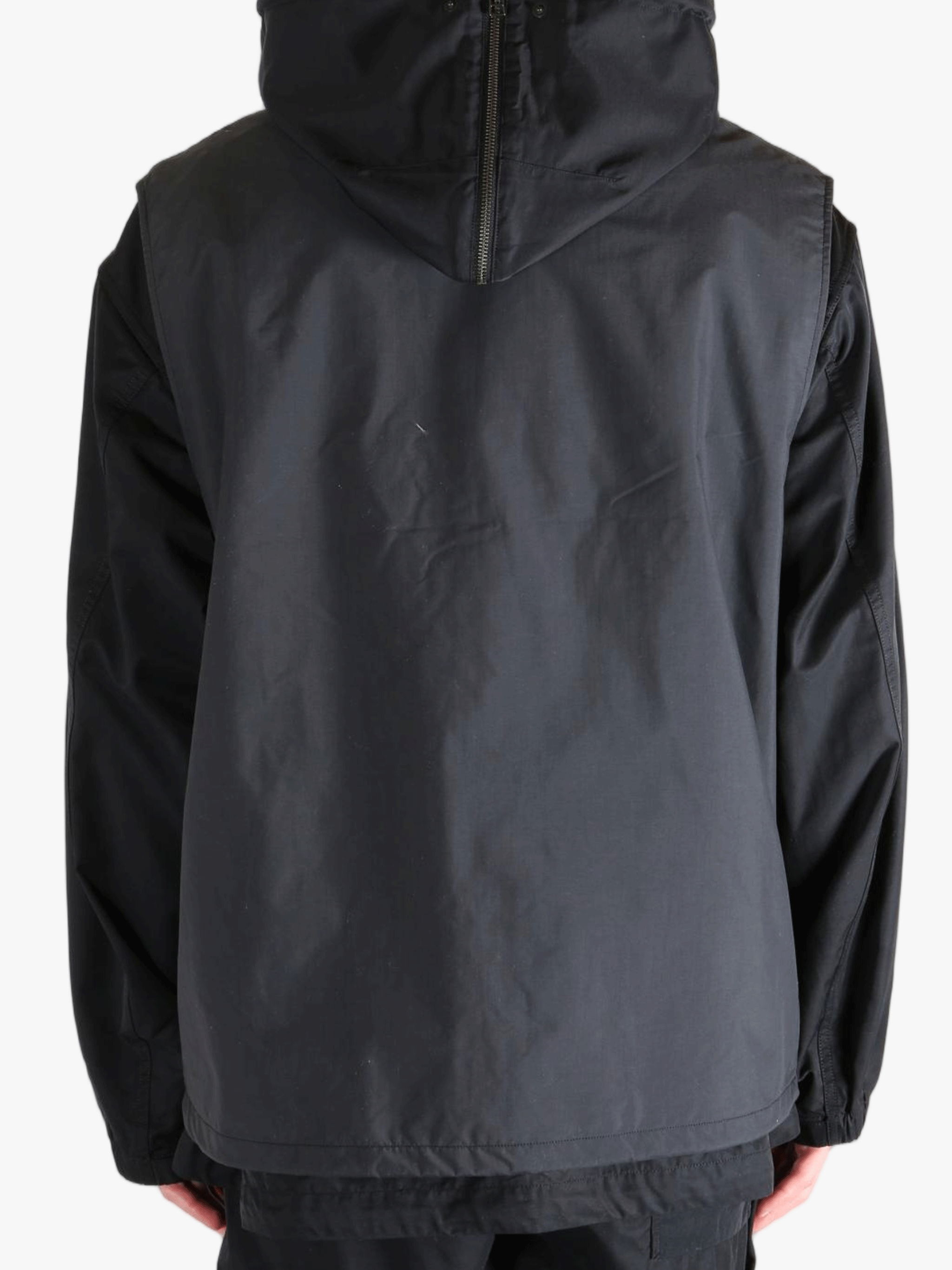 Black top worn by a person, showing the top's fit