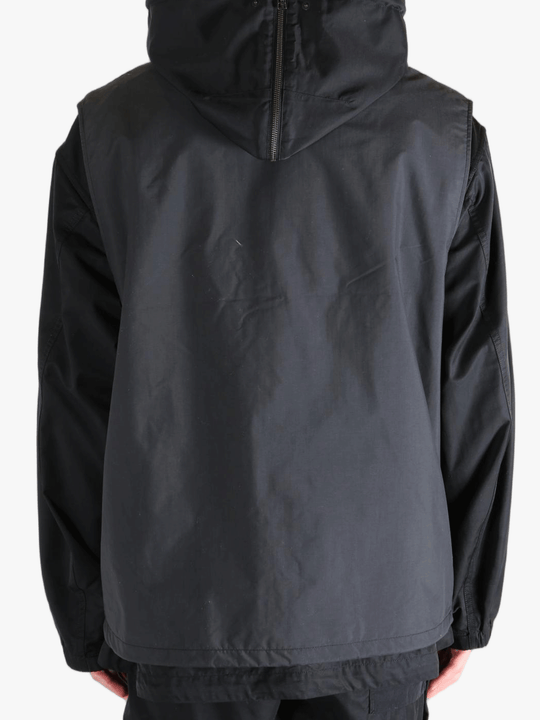 Black top worn by a person, showing the top's fit